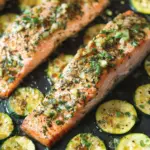 Place the baking sheet in the preheated oven and bake for 15-20 minutes, or until the salmon is cooked through (it should reach an internal temperature of 145°F or 63°C) and the zucchini is tender with golden edges Recipe