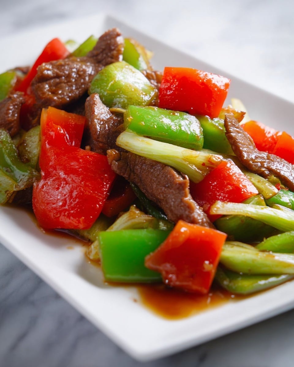 The dish shows a white rectangular plate filled with stir-fried ingredients arranged in three visible layers: the bottom layer is white and light green slices of cooked scallions, the middle layer has glossy bright green bell pepper chunks and vibrant red bell pepper pieces with a slightly soft texture, and the top layer includes dark brown strips of cooked beef with a slight shine from sauce. The sauce lightly covers the food and pools slightly on the plate. The plate sits on a white marbled surface. photo taken with an iphone --ar 4:5 --v 7
