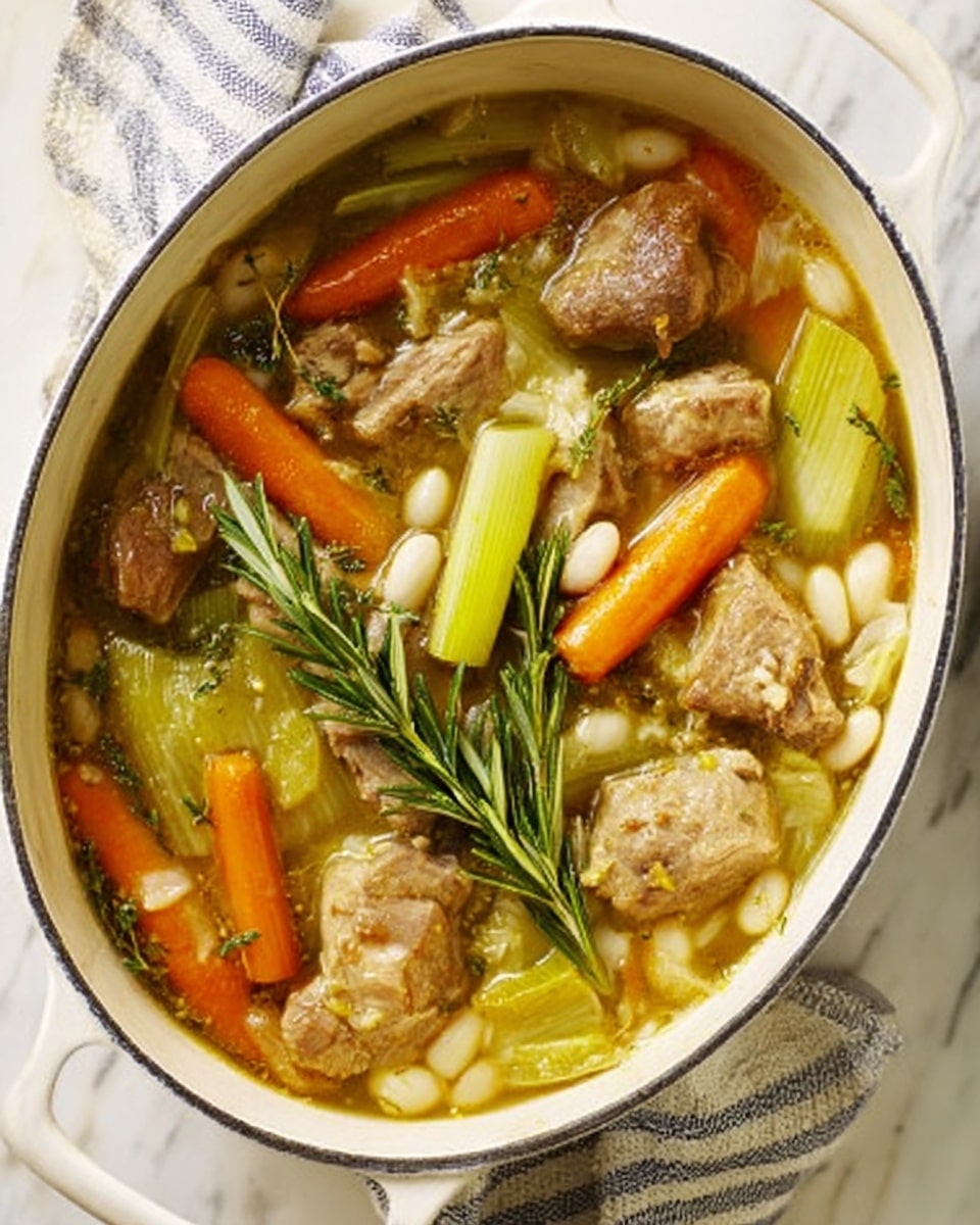 The dish is served in a white oval pot with handles on both sides, placed on a white marbled surface with a striped cloth underneath. Inside the pot, chunky pieces of orange carrots and light green leeks are cut into thick sections, sitting among small brown chunks of cooked meat and scattered white beans. There are sprigs of fresh green rosemary lying on top, and a light broth partially covers all ingredients, giving a warm and hearty look to the dish. photo taken with an iphone --ar 4:5 --v 7