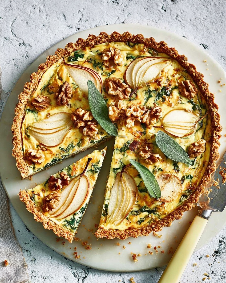 The image shows a round tart with a golden brown crust, placed on a white marbled surface. The tart has a base layer of creamy cheese mixed with green spinach leaves, topped with thin slices of roasted pear that have a caramelized brown edge. Scattered between the pears are whole walnut pieces with a light brown color and a few fresh sage leaves that add a deep green color and a slightly fuzzy texture. One slice of the tart has been cut and slightly pulled out to the side, showing the layers clearly. A white-handled knife is placed next to the tart, and a glass of white wine is partially visible in the corner. The overall look is rustic and colorful, with contrasting textures of soft cheese, crunchy walnuts, and tender pears. Photo taken with an iphone --ar 4:5 --v 7