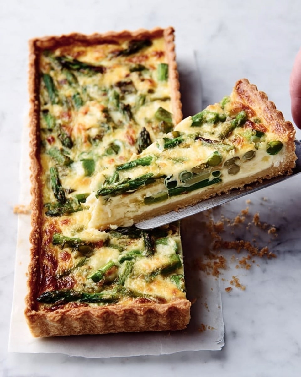 The image shows a rectangular tart with a golden-brown crust that is thick and crispy around the edges. Inside the tart are three main layers: the bottom crust, a creamy white cheese layer in the middle, and a bright green vegetable layer on top, likely asparagus or green beans, covered partially by a melted yellowish cheese layer with some browned spots from baking. A woman's hand is holding a spatula lifting one triangular slice from the tart, showing the soft, creamy texture and crisp crust. The background is a white marbled texture. Photo taken with an iphone --ar 4:5 --v 7