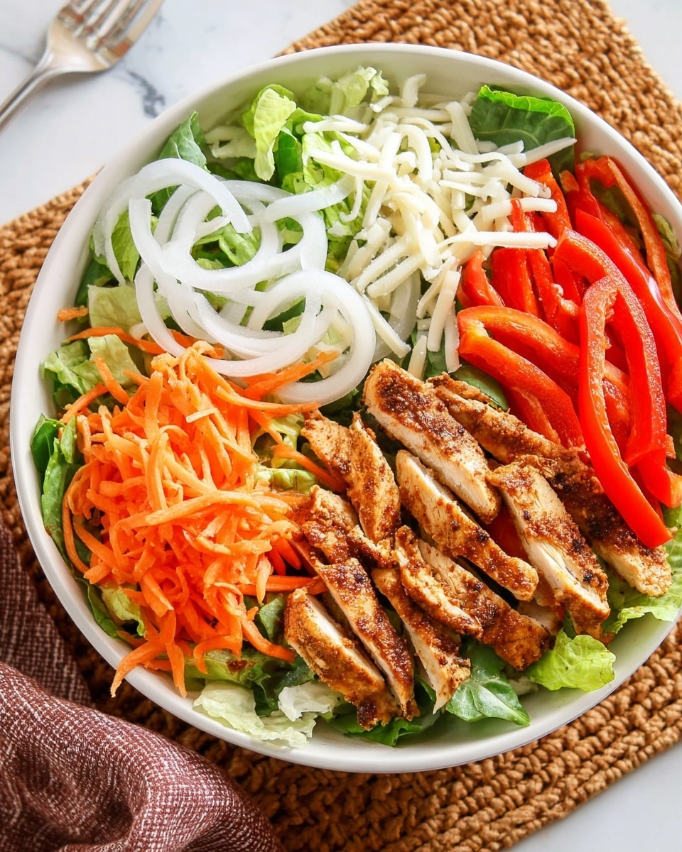 A white bowl filled with a fresh salad on a white marbled surface, starting with a base layer of green lettuce leaves, topped with four sections of colorful vegetables and protein: bright orange shredded carrots on the left, sliced white onions next to them, bright red bell pepper strips at the top, and grilled, sliced chicken breast with a golden brown, seasoned crust on the right. The entire dish is sprinkled with white shredded cheese, adding texture and lightness to the vibrant layers. photo taken with an iphone --ar 4:5 --v 7