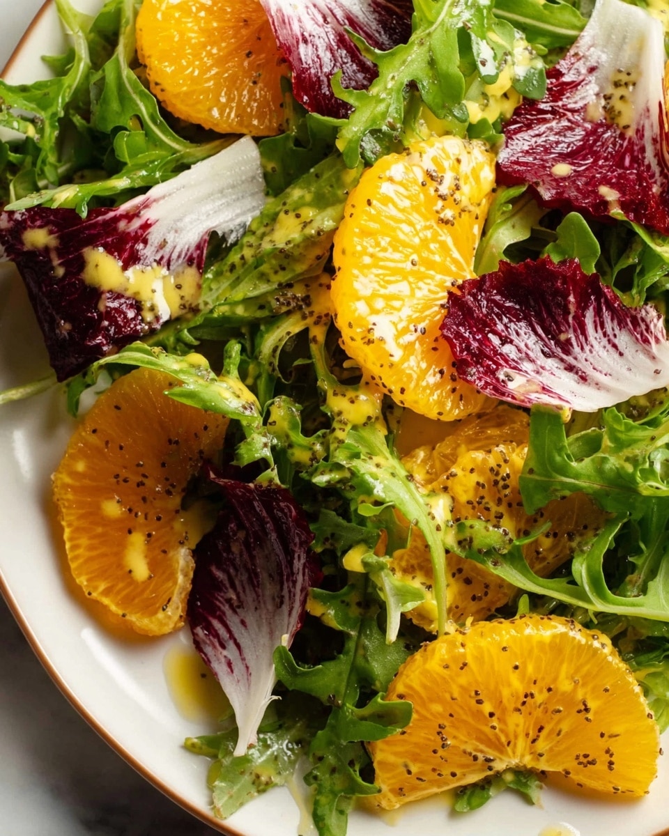 A fresh salad is shown in a white bowl placed on a white marbled surface. The salad has three visible layers: the bottom layer is a mix of bright green arugula leaves and light green frisée with a curly texture, the middle layer consists of deep red radicchio leaves with white veins, and the top layer is made of vibrant orange citrus slices, some with a light dressing on them speckled with black poppy seeds. The dressing appears creamy and slightly glossy, adding a shiny touch on parts of the greens and citrus. Photo taken with an iphone --ar 4:5 --v 7